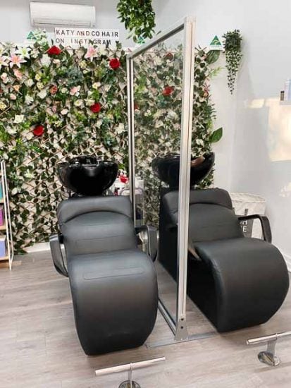 Perspex sneeze guard dividing salon chairs at hairdressing salon in victoria Perspex sneeze guard dividing salon chairs at hairdressing salon in victoria